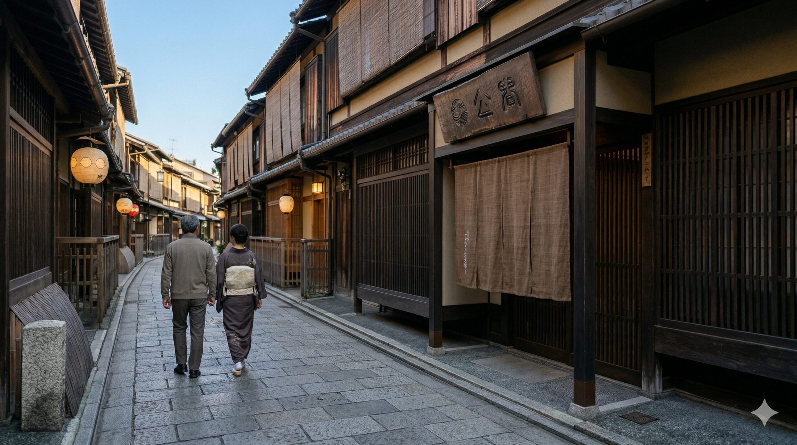 京都の伝統的な通りに調和した、落ち着いた茶色の看板を掲げた現代的な店舗のファサード